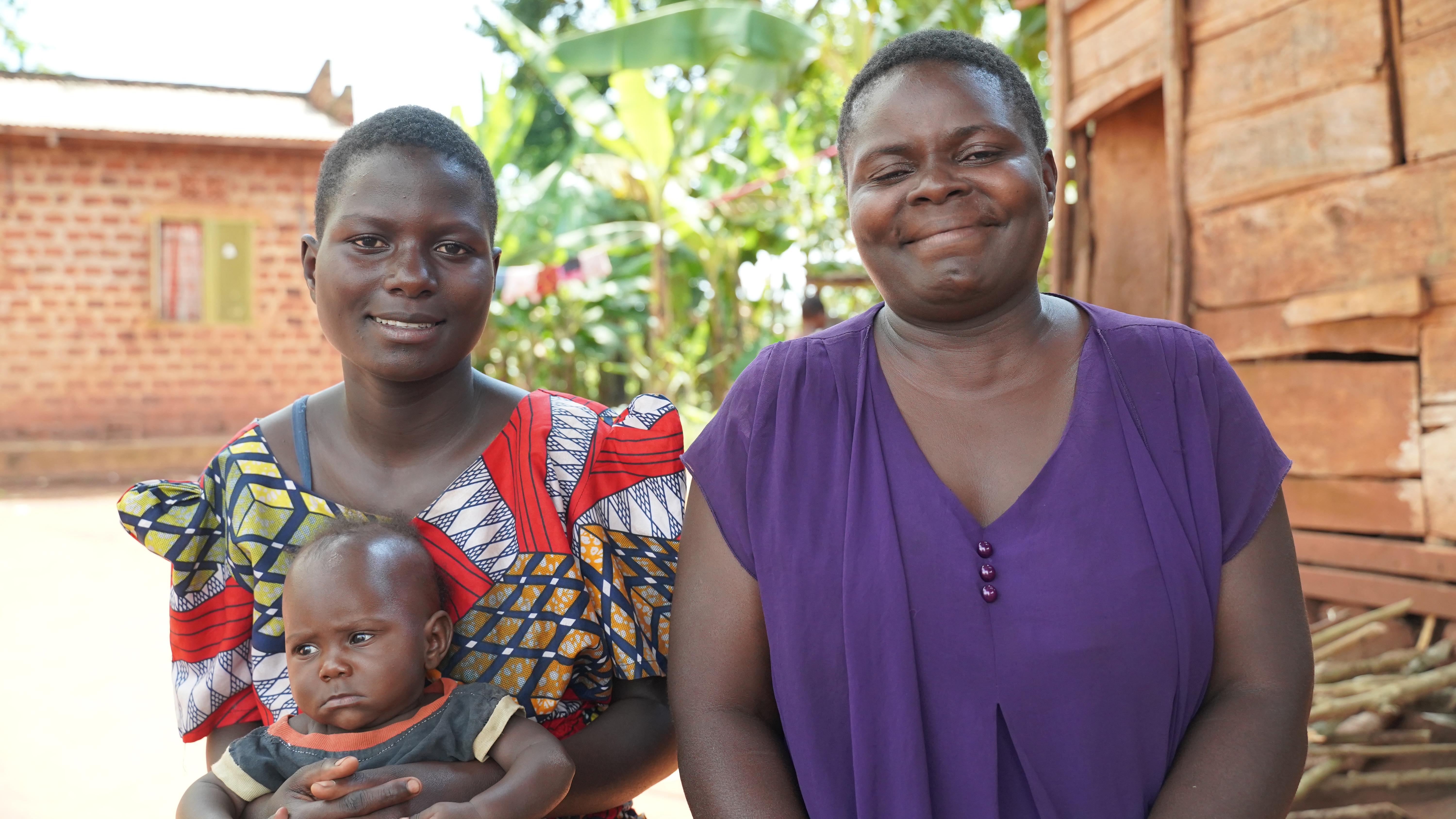 Namuswe Sylvia, 15, with her one-year-old son, and her mother, 29. Photo: Caspar Haarløv