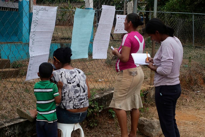Parents collecting homework for their kids Nicaragua photo
