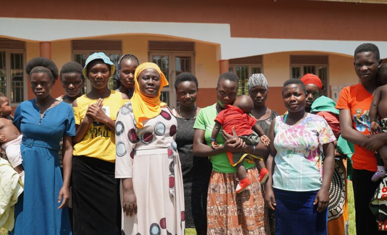 Headteacher Ms Nakayiza Amina of Kisimba Umea primary school with a group of girls who left school  because they were pregnant. However, they were able to return to school to sit their exams. Some of the girls are now mothers; others lost their babies due to miscarriages. 