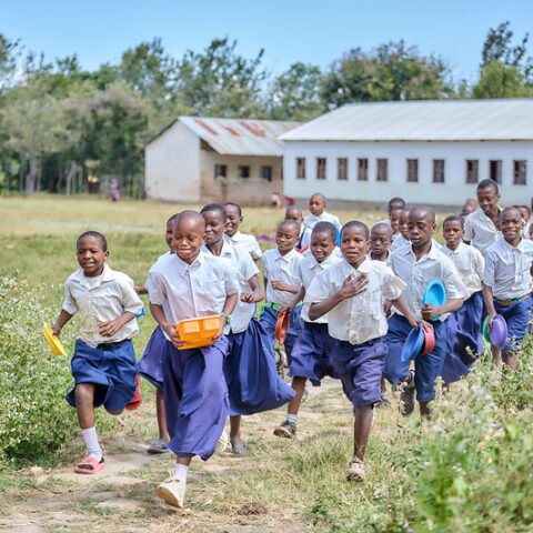 Students at Idugumbi Primary School, Mbeya, Tanzania, take their lunch break.