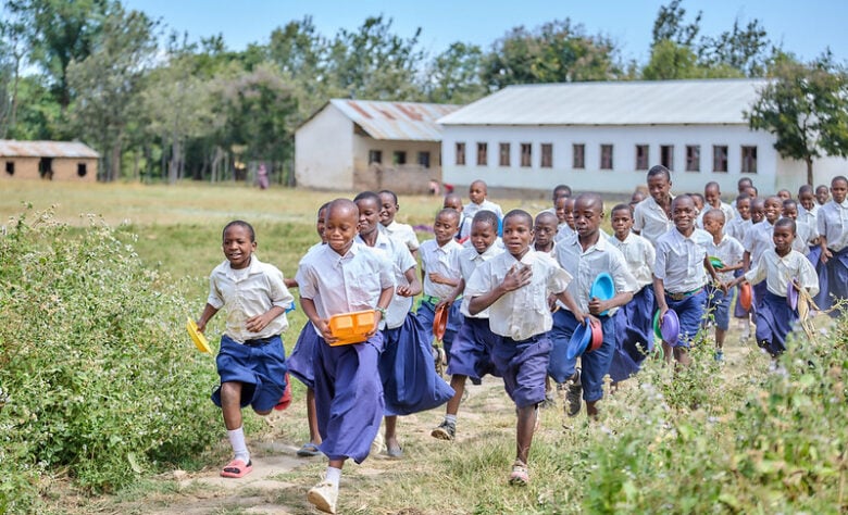 Students at Idugumbi Primary School, Mbeya, Tanzania, take their lunch break.