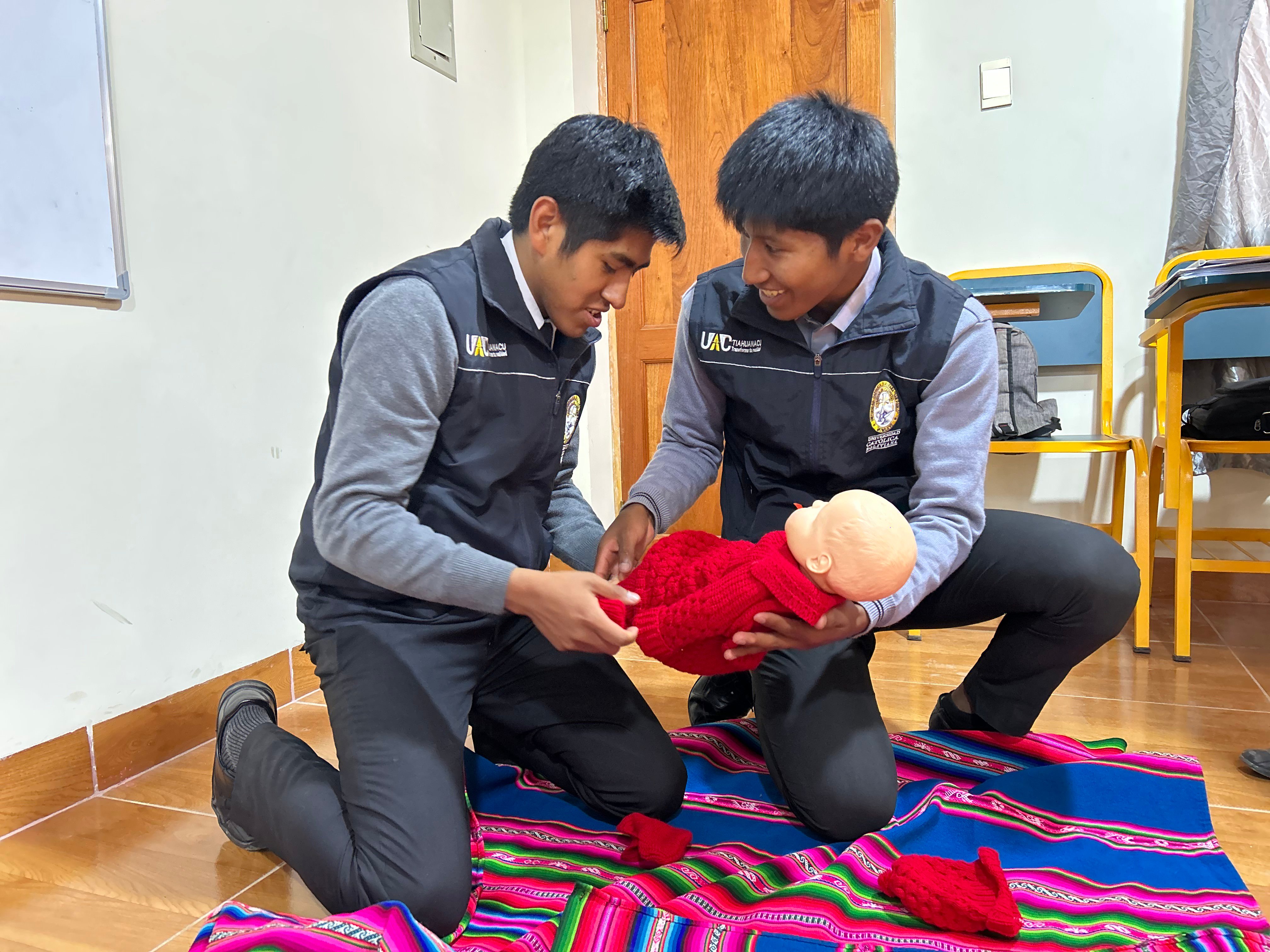 Two young boys with doll